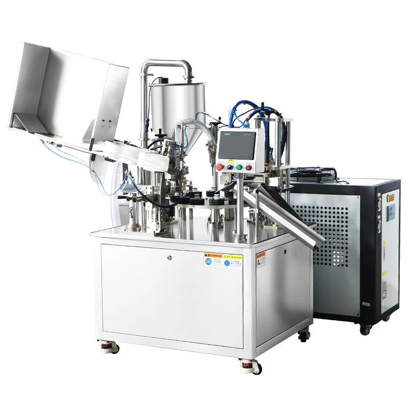 Automatic tube filling and sealing machine for creams and lotions